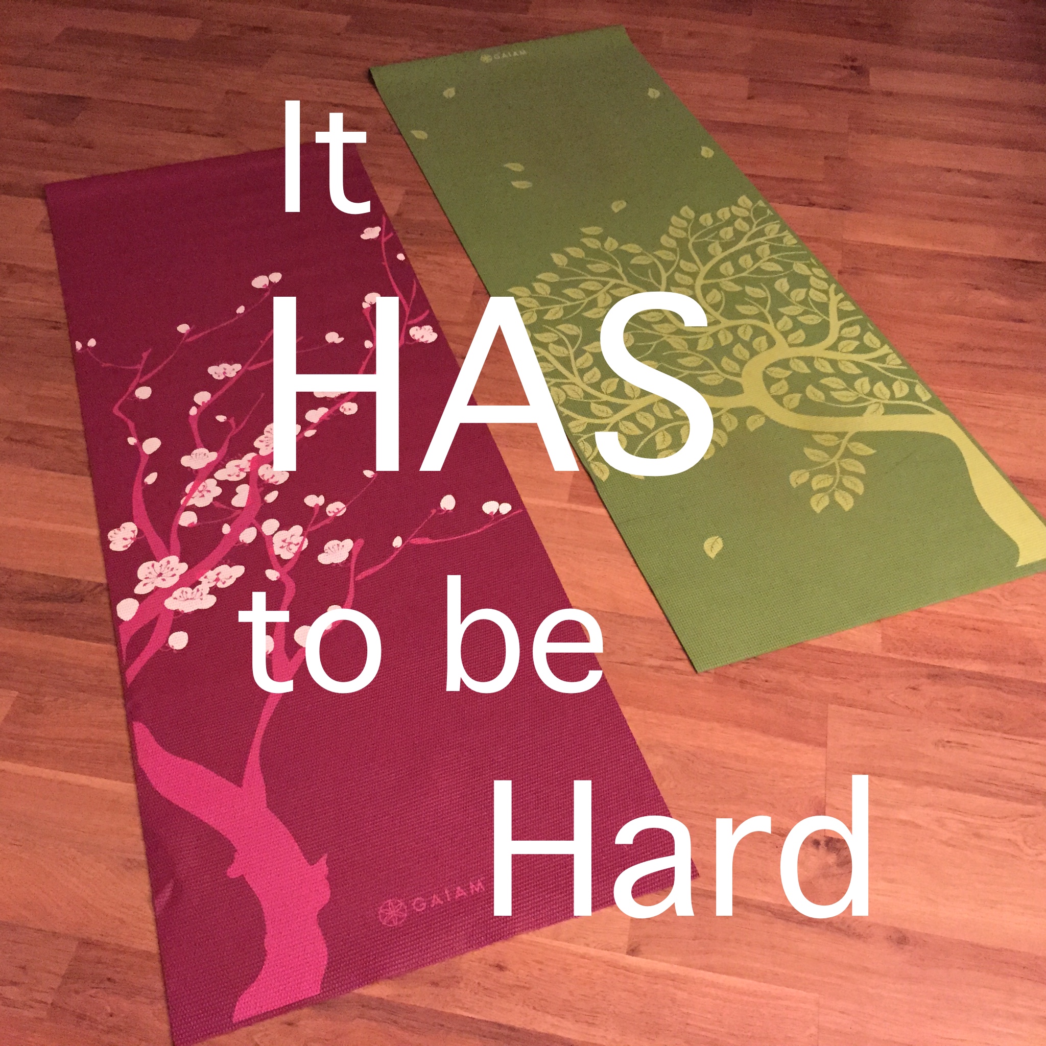 two yoga mats on wood floor; text overlay "It has to be hard"