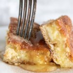 Sopapilla Cheesecake Bars is one of my husband's most requested desserts of all time! Real, creamy cheesecake layered between flaky croissant dough and topped with cinnamon, sugar, and honey - it's heavenly!