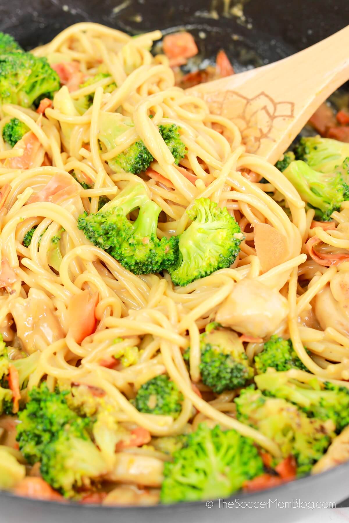 skillet with noodles and broccoli in peanut sauce