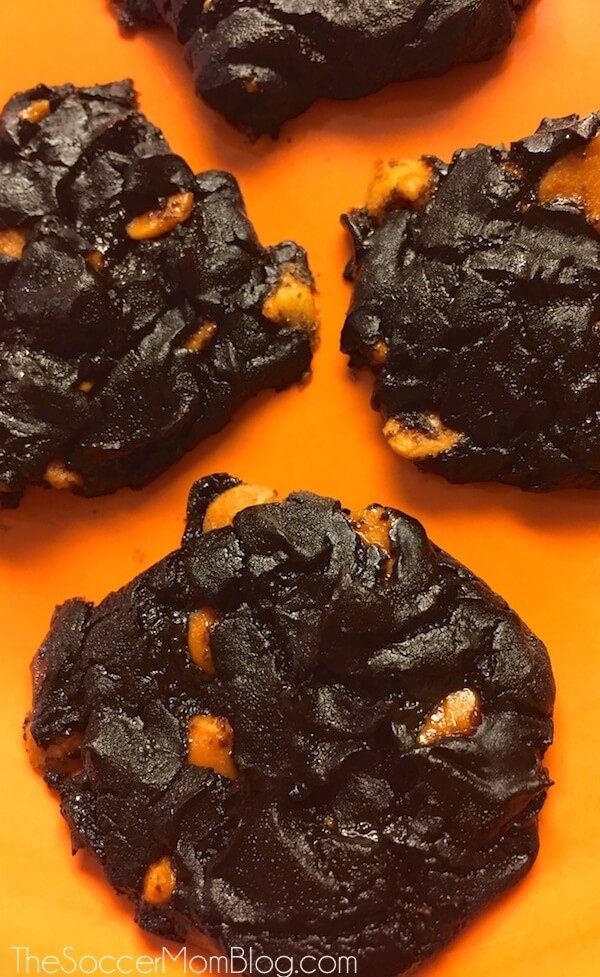 chocolate cookies with orange chips on an orange background