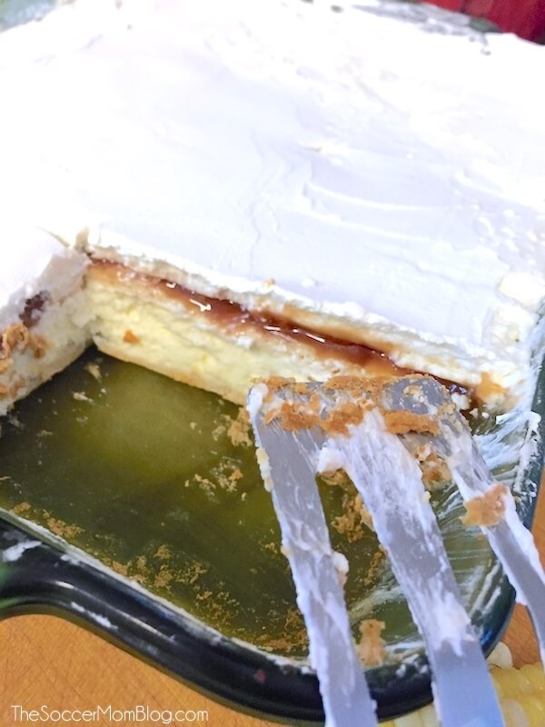 Guava cheesecake in pan with slice missing