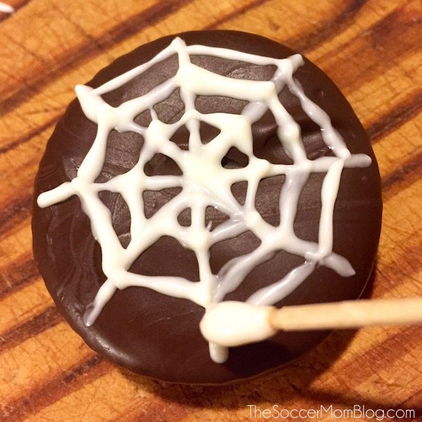 A holiday favorite with a Halloween twist: Chocolate Dipped Peanut Butter Crackers (aka Spiderweb Cookies) are incredibly easy & perfect to make with kids! Did I mention they combine two of my favorite things, chocolate and peanut butter?? #SpreadTheMagic [ad] - The Soccer Mom Blog