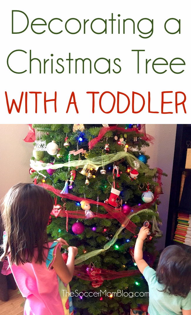 Helpful ideas to make decorating a Christmas tree with a toddler easier, safe, and FUN! 