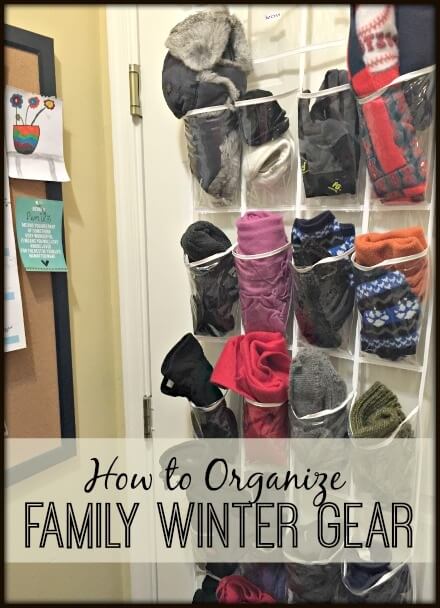 using a hanging shoe rack to organize winter clothing