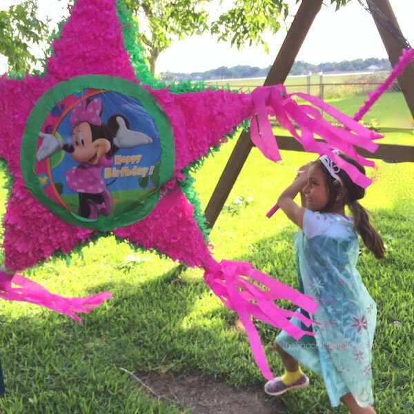Lots of fun and easy ideas for a frugal Minnie Mouse birthday party for kids - birthday cake, decorations, goodie bags, and tips to keeps costs low!