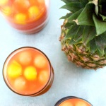 The perfect summer party cocktail recipe: Tropical Rum Punch is like a vacation in your mouth! Easy, gorgeous, smooth, and fruity - it's a crowd pleaser!