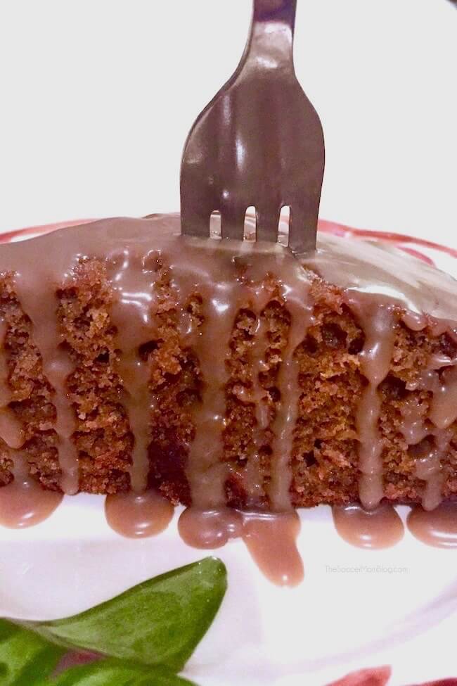 fork in top of a slice of pumpkin spice cake