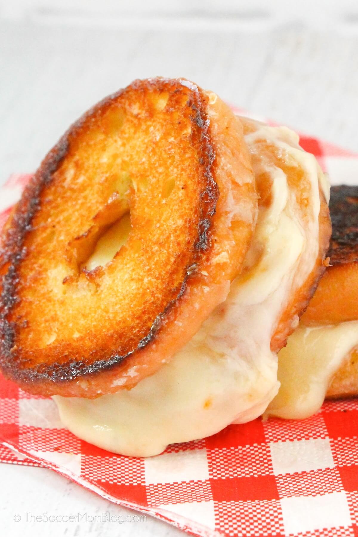 gooey donut grilled cheese sandwich, stacked on top of another donut