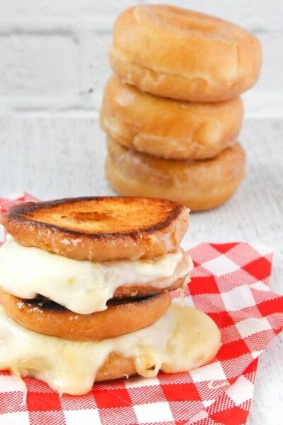 Just like you'd find at the state fair, this Donut Grilled Cheese will send you away into carb-y, cheesy bliss! Dessert, lunch, snack, anytime!