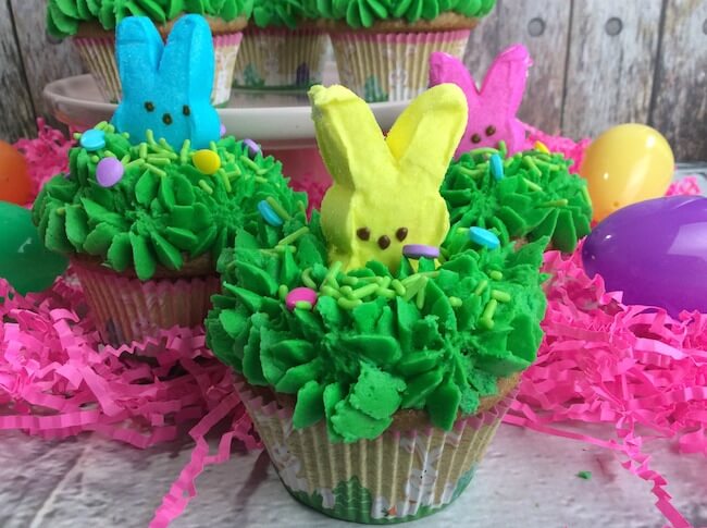 Absolutely adorable Peeps Bunny Cupcakes are the perfect Easter party dessert! Rich carrot cake & an easy recipe!