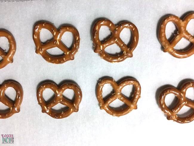 mini pretzel twists on a lined baking sheet