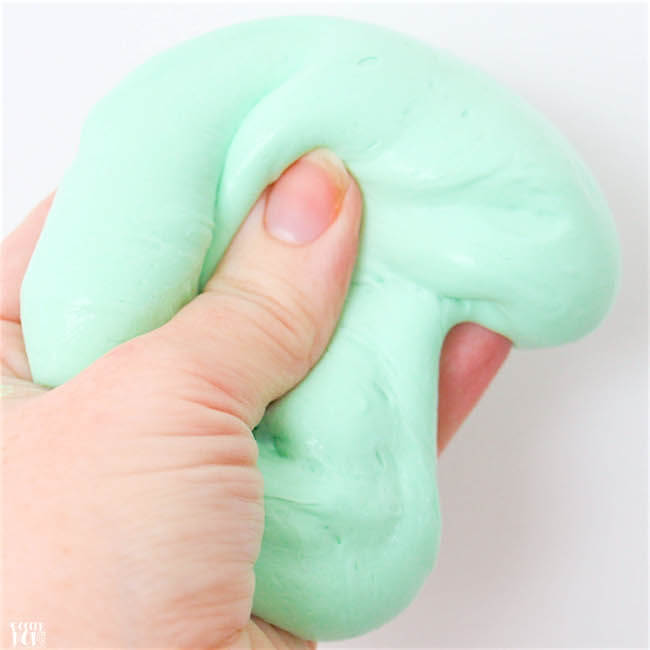 Homemade fluffy slime in hand