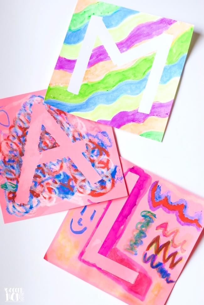Kids will love creating their initial (or any design) with this easy tape-resist technique! A mess free painting activity for all ages & fun art gift idea!