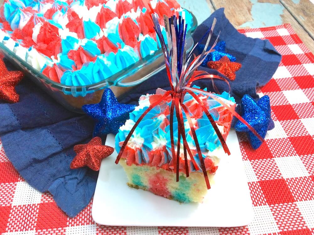 This stunning Red White & Blue Jello Poke Cake is guaranteed to be the star of the party! The perfect patriotic dessert for Memorial Day or the 4th of July.