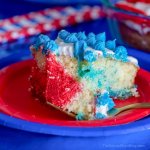 This stunning Red White and Blue Poke Cake is guaranteed to be the star of the party! It's perfect patriotic dessert for Memorial Day and 4th of July!