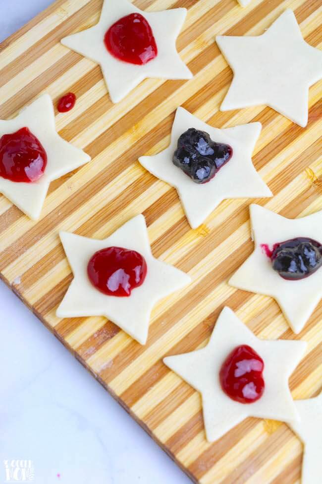 These Blueberry & Strawberry Star Hand Pies are the perfect patriotic dessert for your 4th of July party or grab-and-go treat for your summer BBQs!