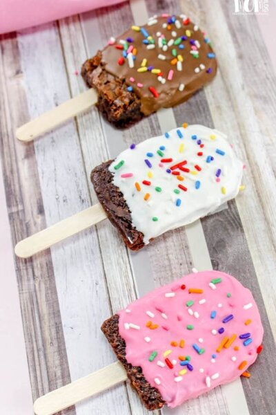 brownies dipped in chocolate on a stick to look like popsicles