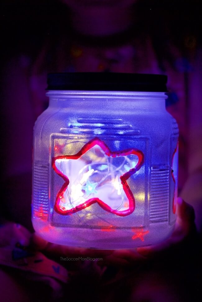 Add a gorgeous glow to your Memorial Day or 4th of July celebrations with these fun and easy patriotic kid-made mason jar lanterns!