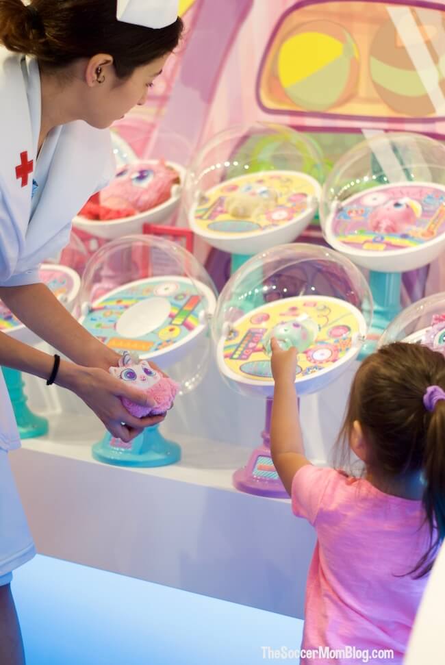 How your child can adopt an Alien Neonate Baby at Distroller World Houston, plus the benefits of pretend play with dolls.