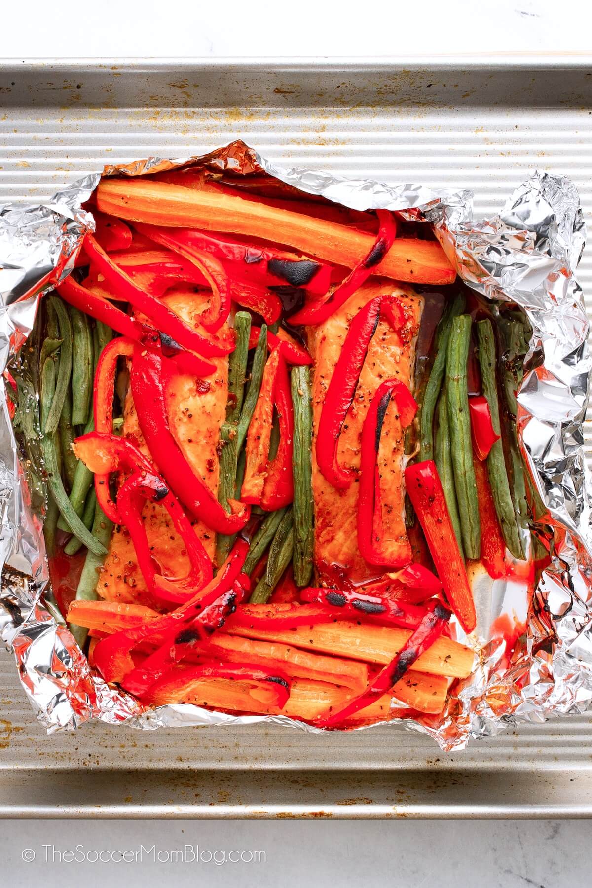 salmon and veggies in an open foil packet