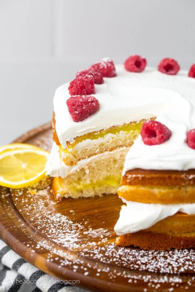 layered lemon cake with slice missing