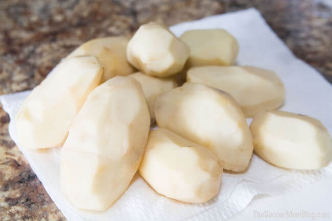 peeled potatoes on countertop