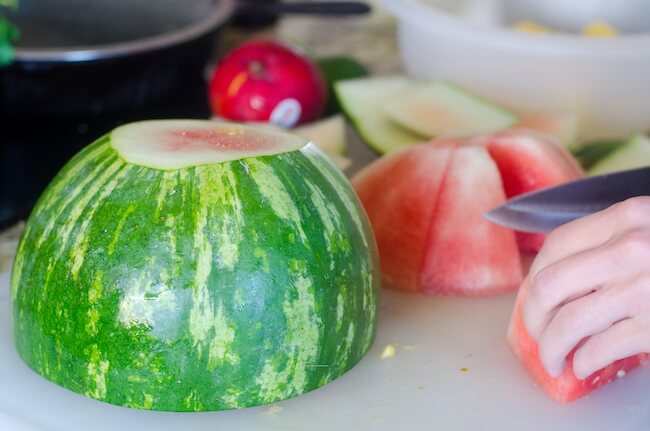 chopping a watermelon