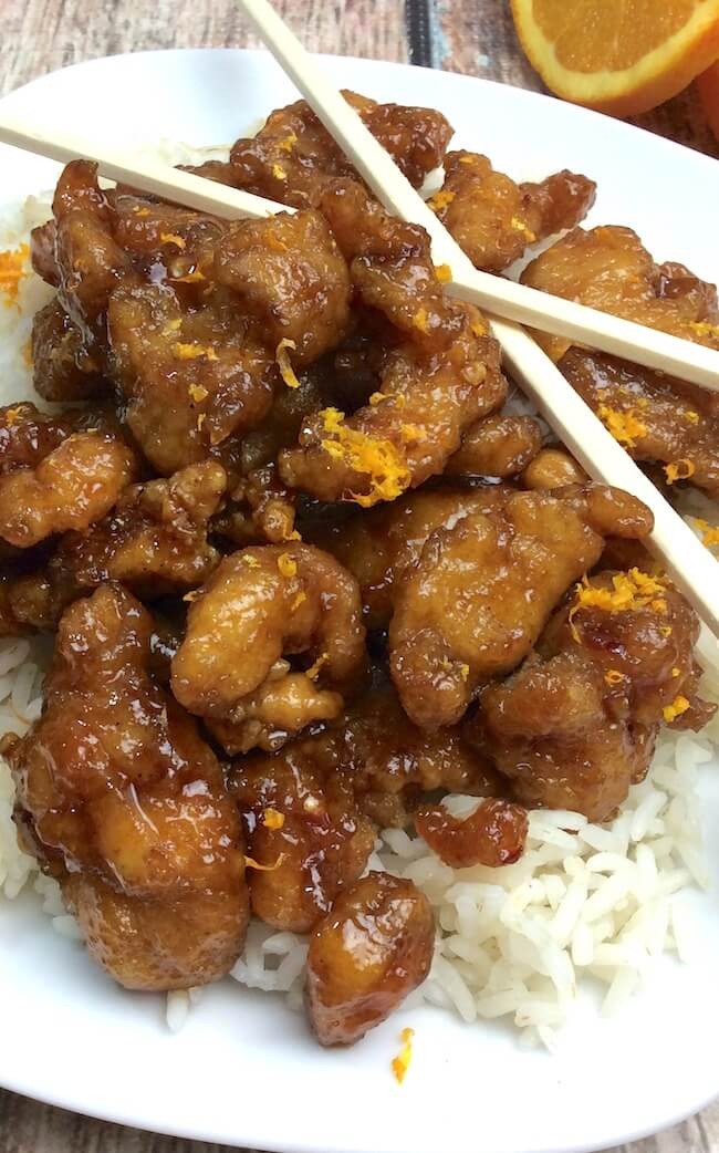 A spot-on copy cat of Panda Express' famous Crispy Orange Chicken that you can easily make at home. Simple, real ingredients for this Chinese food fav!