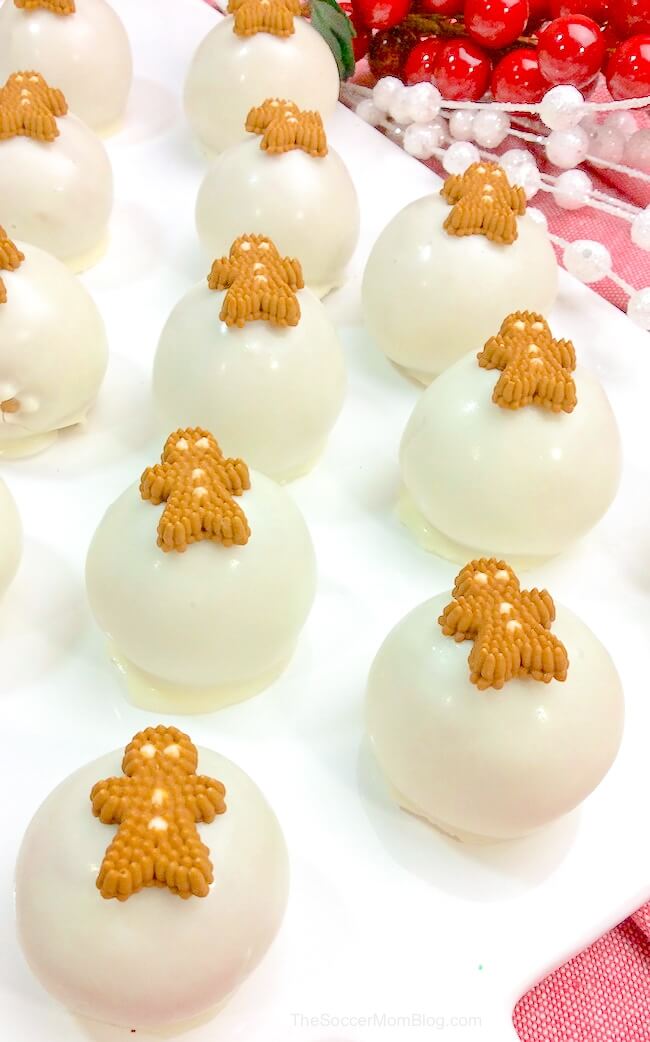 homemade truffles coated in white chocolate with gingerbread men decorations