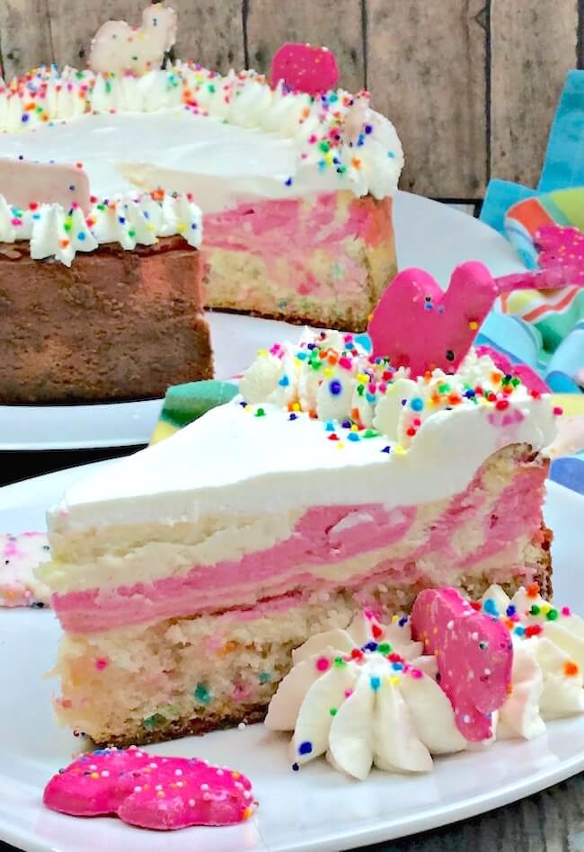 This recipe puts the "fun" in funfetti cheesecake! A funfetti cake-bottom crust pink swirled cheesecake that'll really get the party started!