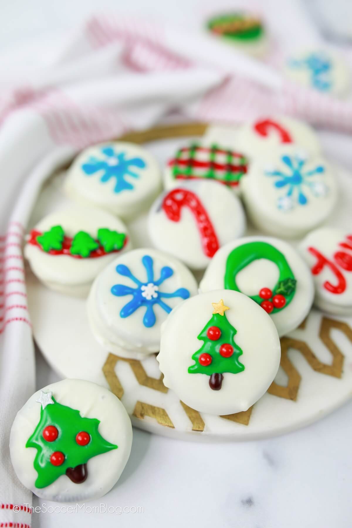 Oreos coated in white chocolate, with Christmas designs in frosting
