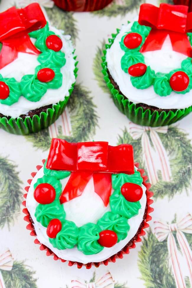 cupcakes decorated with a Christmas wreath.