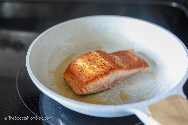 perfectly cooked salmon filet in sauté pan