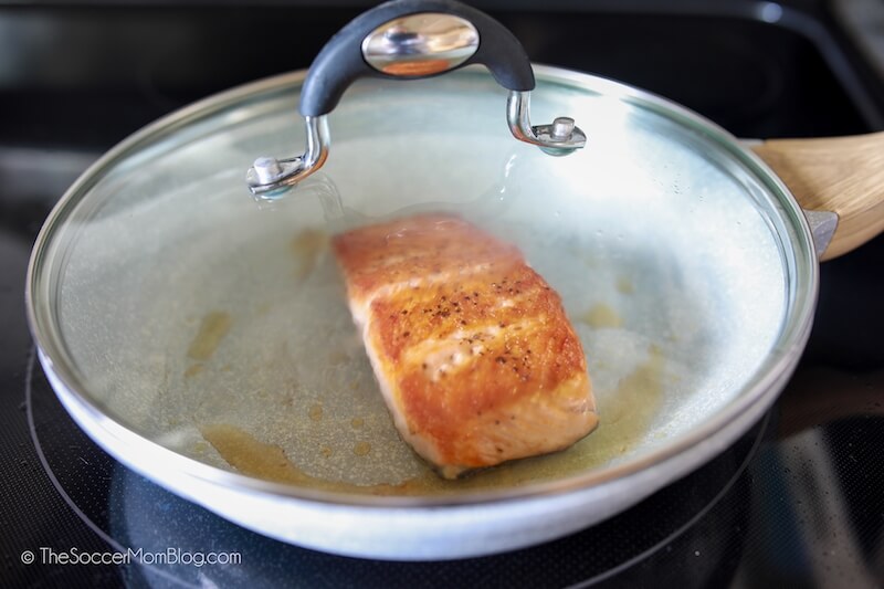 steaming salmon in saute pan