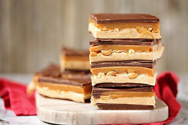 It's hard to imagine that you could improve upon the perfection that is a Snickers candy bar. However, these ooey-gooey Homemade Snickers Bars do just that!!