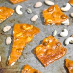 pieces of honey nut brittle on baking sheet