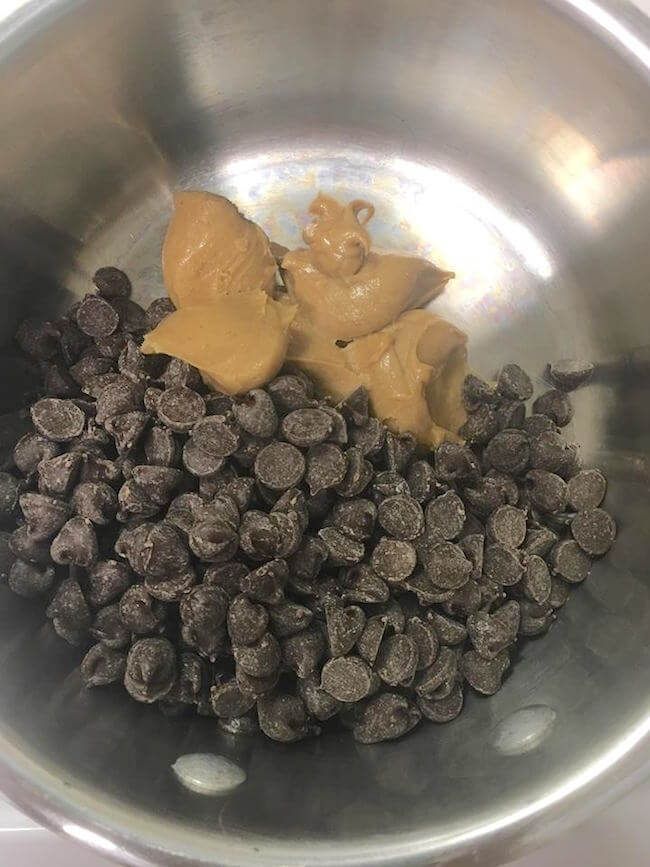 Peanut butter & chocolate chips in mixing bowl