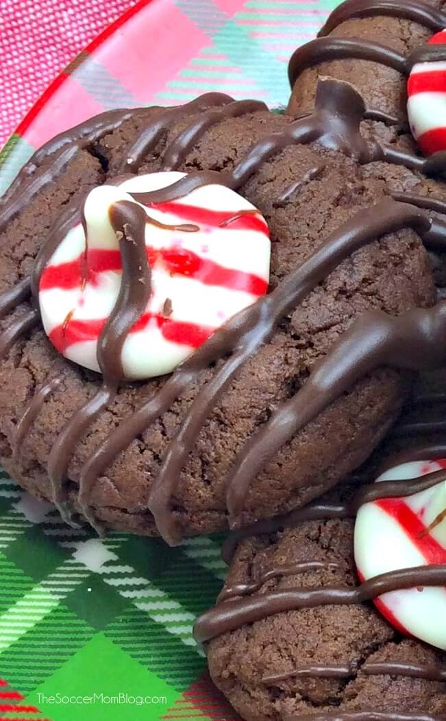 A festive twist on traditional Hershey's kiss cookies, these Chocolate Peppermint Thumbprint Cookies combine the two favorite flavors of the holiday season!