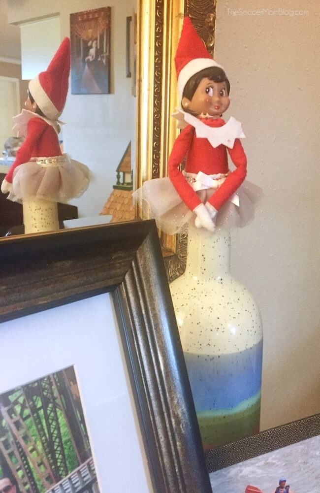 Elf on a Shelf doll in a decorative jar