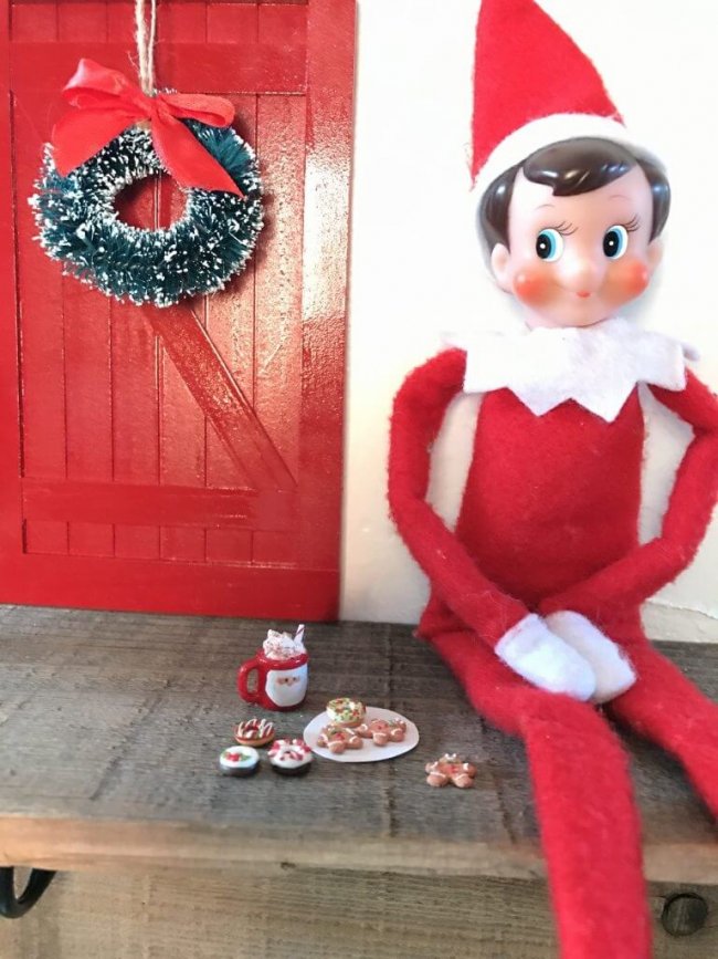 Elf on the Shelf doll with tiny pretend Christmas cookies