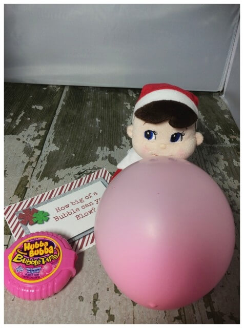 Elf blowing bubble with gum