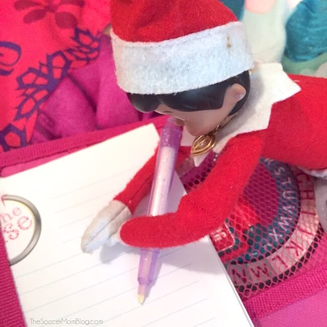 Elf writing a note with invisible ink