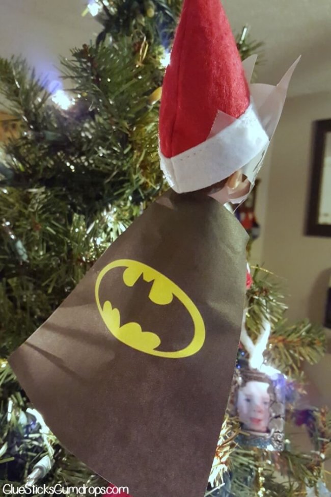 Elf wearing a batman cape