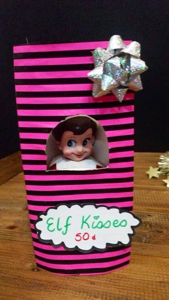 Elf on the Shelf in a kissing booth