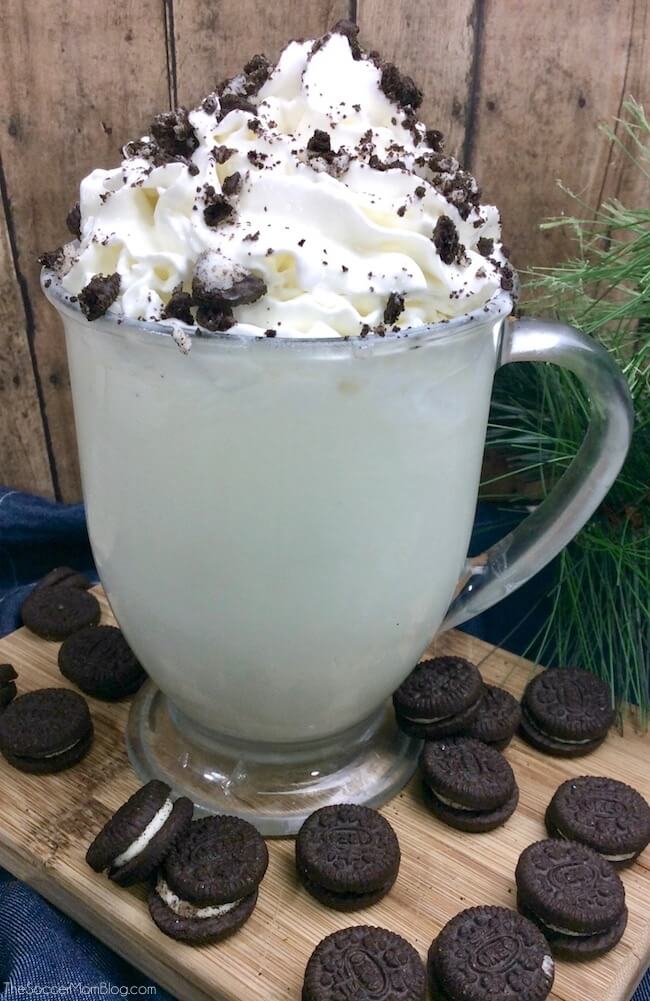 mug of white hot chocolate topped with crushed Oreo cookies
