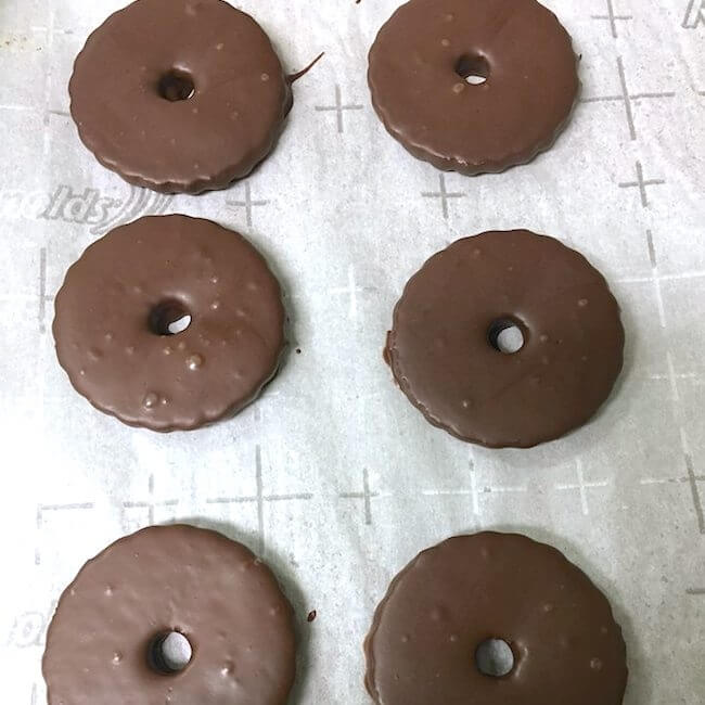 chocolate covered cookies on parchment paper