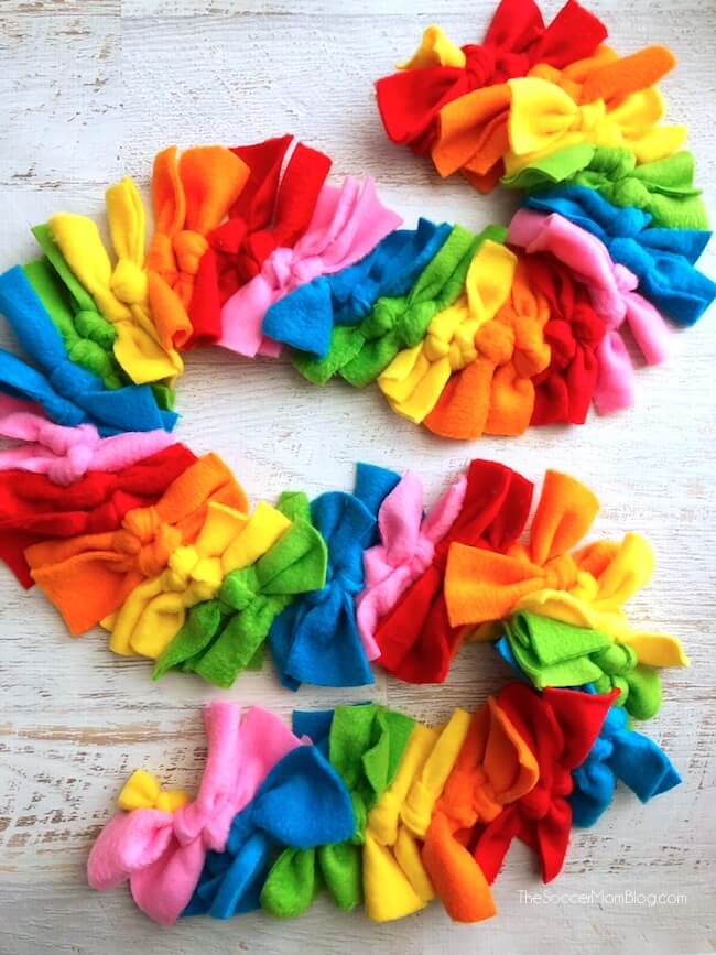 Little fashionistas will love this vibrant Rainbow Dash inspired no sew fleece scarf and you won't believe just how easy it is to make! Simple step-by-step photo tutorial included.