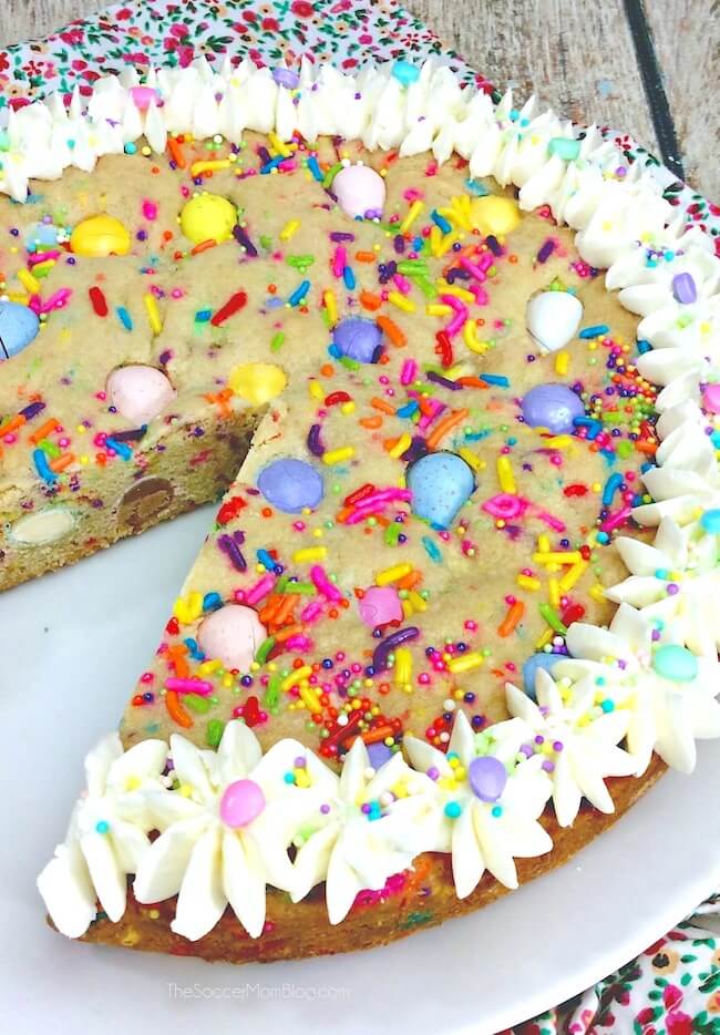 Funfetti Cookie Cake for Easter, with a slice missing