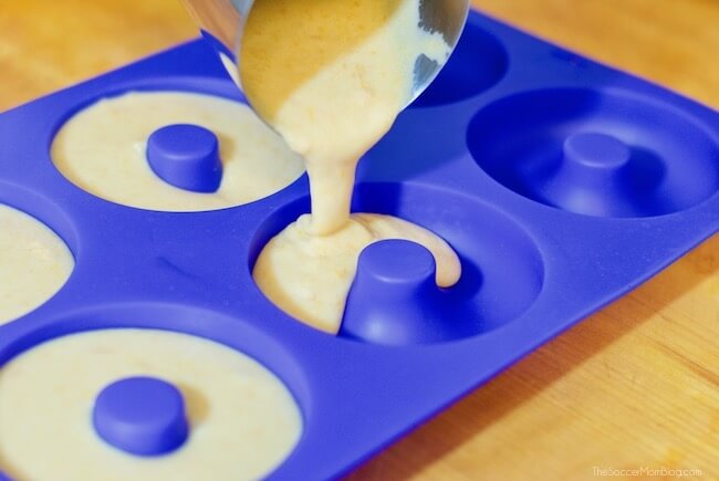Pouring sweet potato donut batter into molds