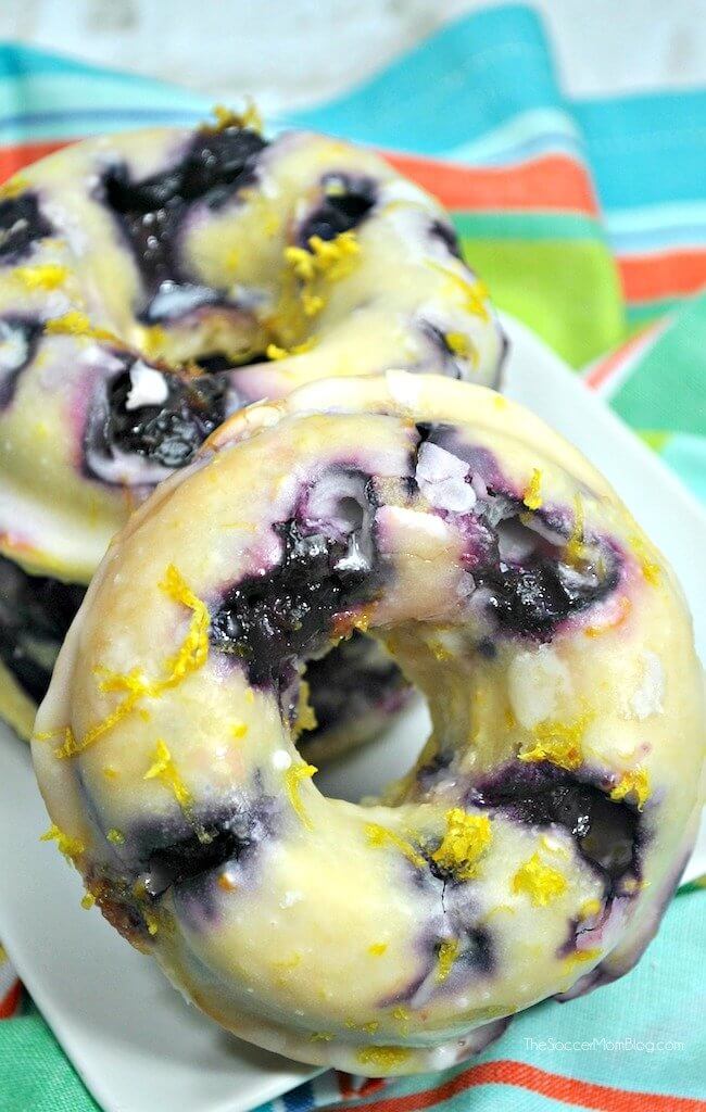 Blueberry Lemon Donuts: light, fluffy, lemon-infused cake donuts bursting with fresh blueberries and topped with a zesty lemon glaze. If your mouth isn't watering yet you might want to check your pulse!